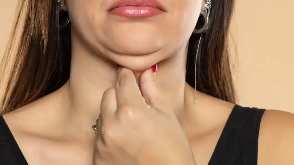 An image of a woman with double chin, sad, worried : Non Surgical Double Chin Removal Treatment in Cheltenham, UK